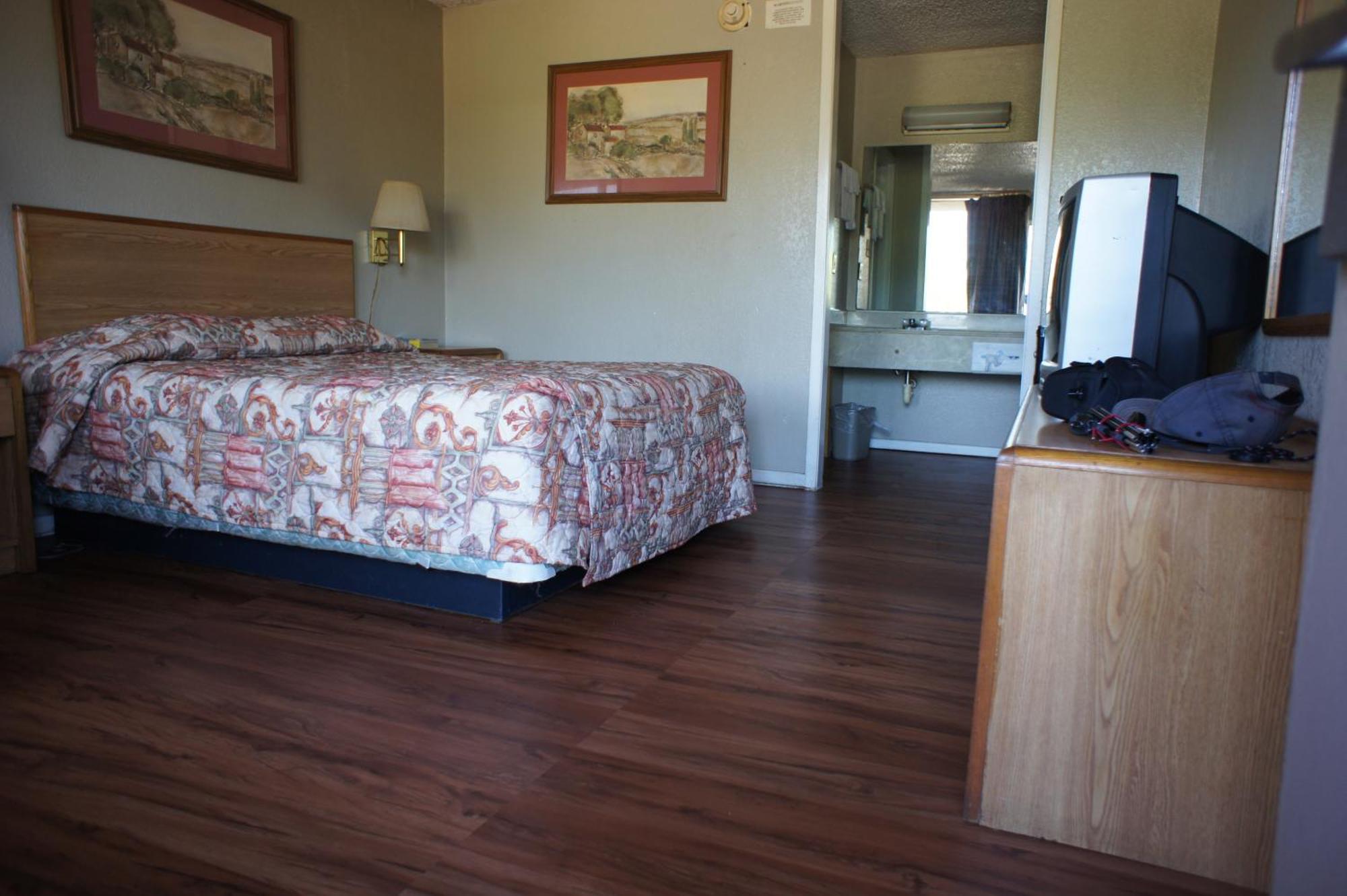 Executive Inn & Suites Orange Quarto foto